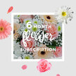 A gentle, romantic bouquet of blush pink roses, creamy peach gerberas, white chrysanthemums and soft clouds of gypsophila is presented as if freshly arranged by a caring florist in Canning Town, ready to be delivered across the neighbourhood. The roses, in shades of delicate pink, form velvety cups of overlapping petals that look almost porcelain-smooth, each bloom at that perfect stage between bud and full opening. Nestled closely around them, the gerberas unfurl wide, daisy-like petals in soft peach and blush, radiating a quiet cheerfulness that feels both welcoming and contemporary. Tiny clusters of white gypsophila float between the larger flowers like a scattering of stars, giving the design a light, airy quality-almost as though the bouquet has been lifted from a dew-touched garden just after sunrise. White chrysanthemums add structure and volume, their crisp, layered petals introducing a cool freshness that keeps the palette from becoming too sweet. Slender green stems and occasional leaves peek through, adding a natural rhythm and hinting at the bouquet's just-picked vitality. The lighting appears soft and diffuse, like daylight slipping through curtains in a flat near Rathbone Market or along the streets leading towards Custom House, flattering every petal and texture. Emotionally, the bouquet suggests renewal, gentle affection and everyday joy, perfect for any occasion where words feel too heavy but a thoughtful gesture is needed. It has the feel of a subscription arrangement, arriving month after month to bring a touch of springtime softness into homes and workspaces throughout Canning Town.